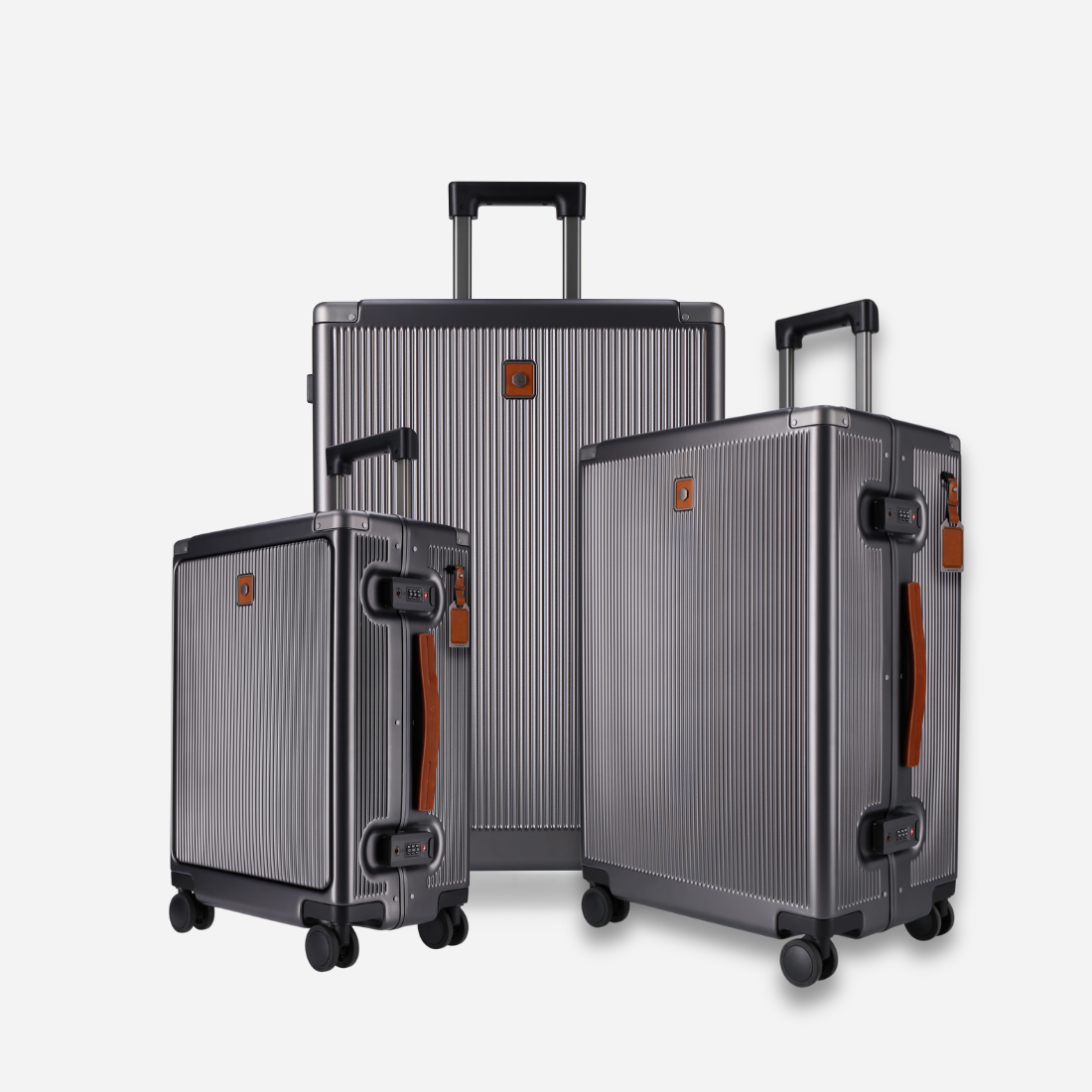 Three gray suitcases with black handles and wheels on a white background