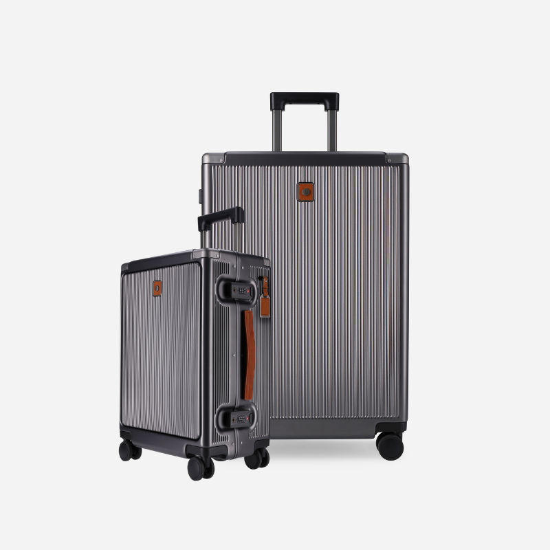 Two suitcases with a striped pattern and visible brand logo on a light gray background