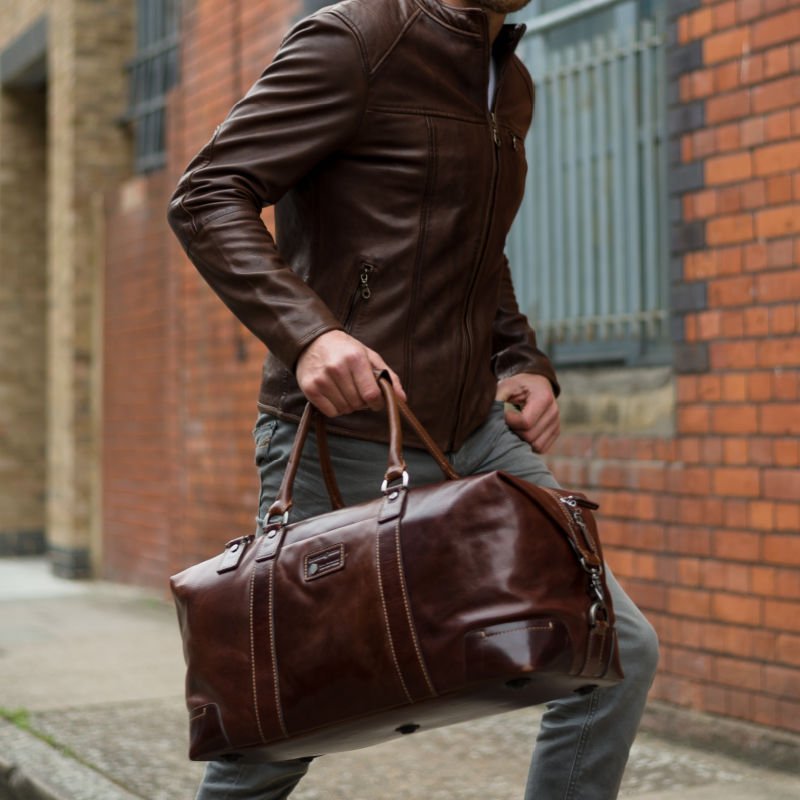 Large 50cm cabin holdall in mocha leather by Jekyll & Hide, carried along street
