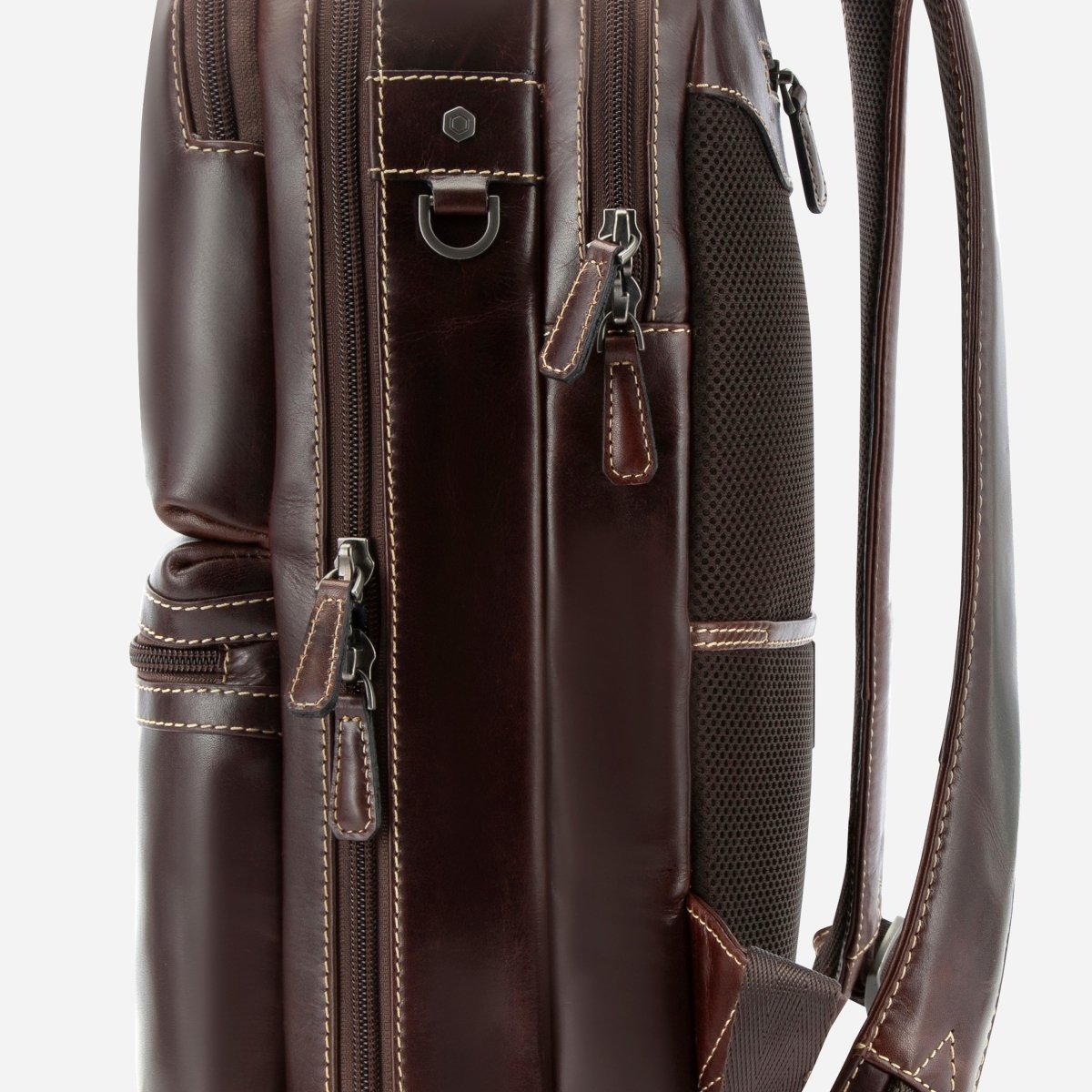 Close-up of the side zips and mesh panel on Jekyll and Hide dark brown leather everyday backpack