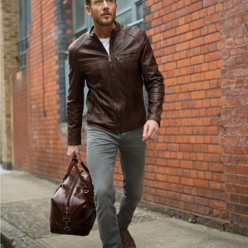 Large 50cm cabin holdall in mocha leather by Jekyll & Hide, carried in hand