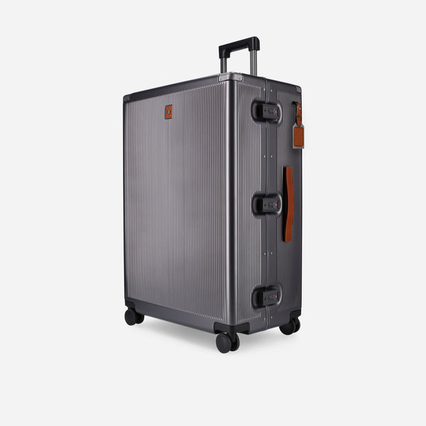 Jekyll and Hide graphite polycarbonate large check-in suitcase with tan leather trim, angled front view