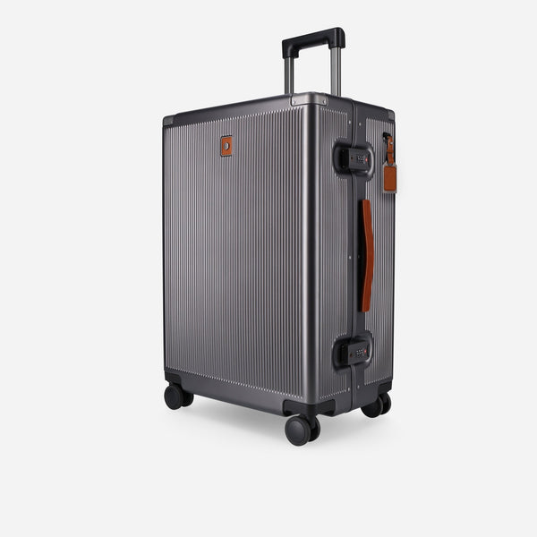 Jekyll and Hide graphite polycarbonate medium check-in suitcase with tan leather trim, angled front view