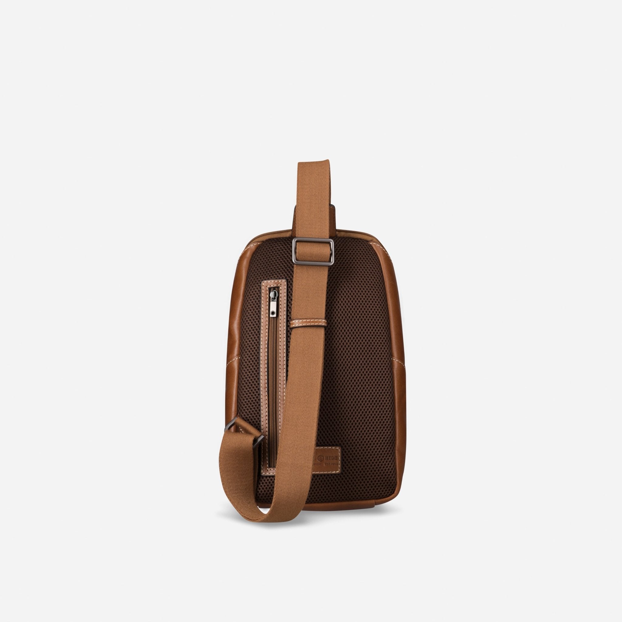 Jekyll and Hide tan leather single-strap backpack, rear view with padded mesh and strap